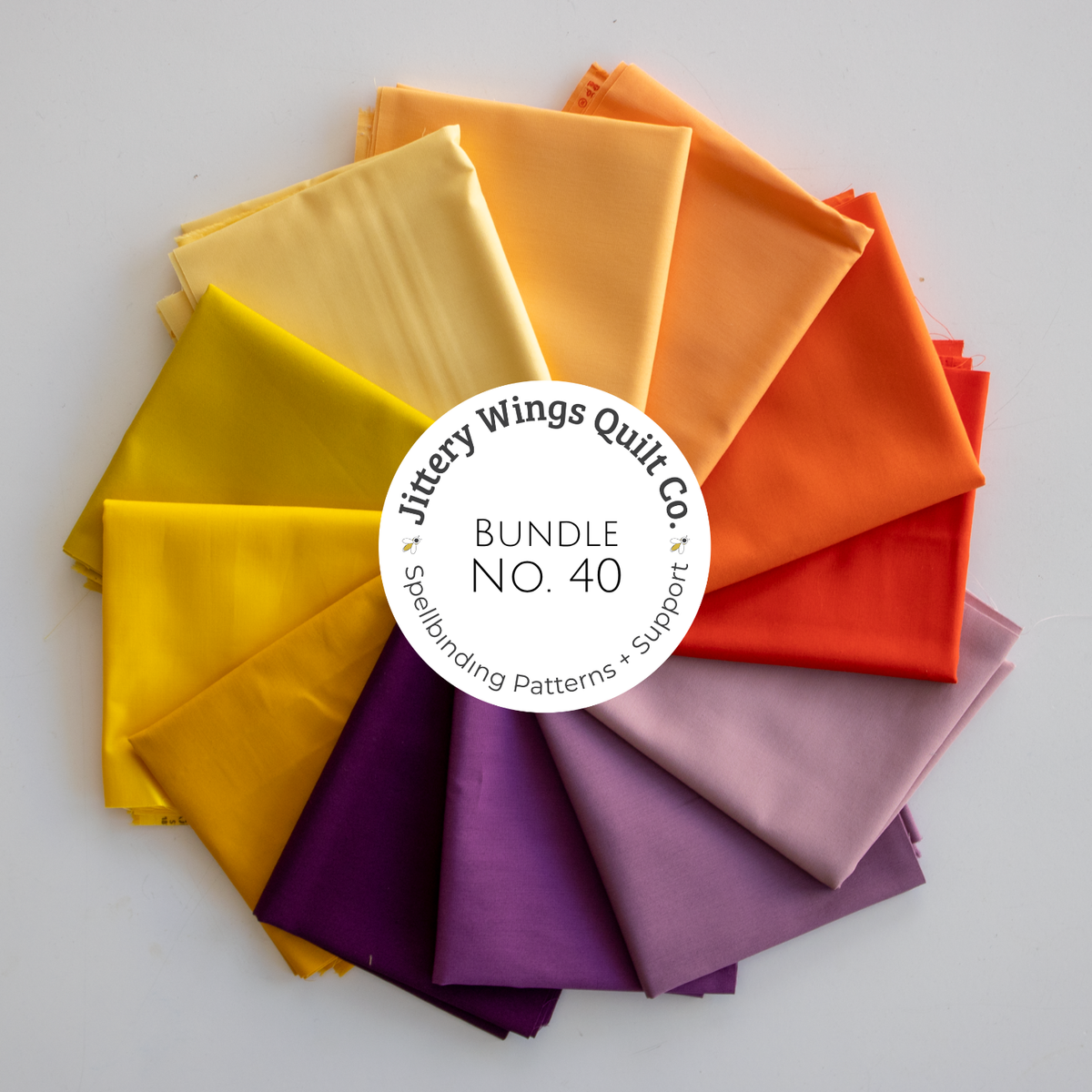 Quilting fabric bundle with assorted solid-color fat quarters in bright shades